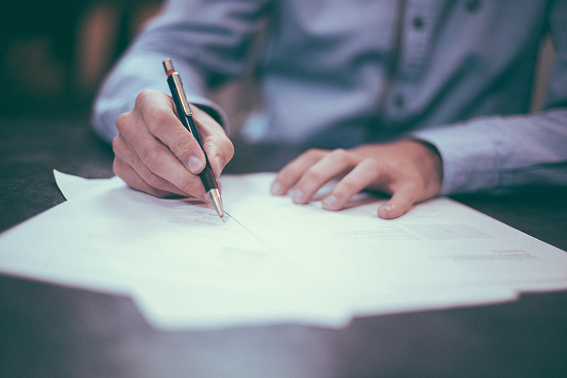 Image of Documents Being Signed